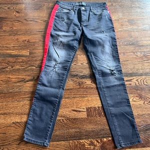Criminal Damage skinny jeans in black with red side stripe